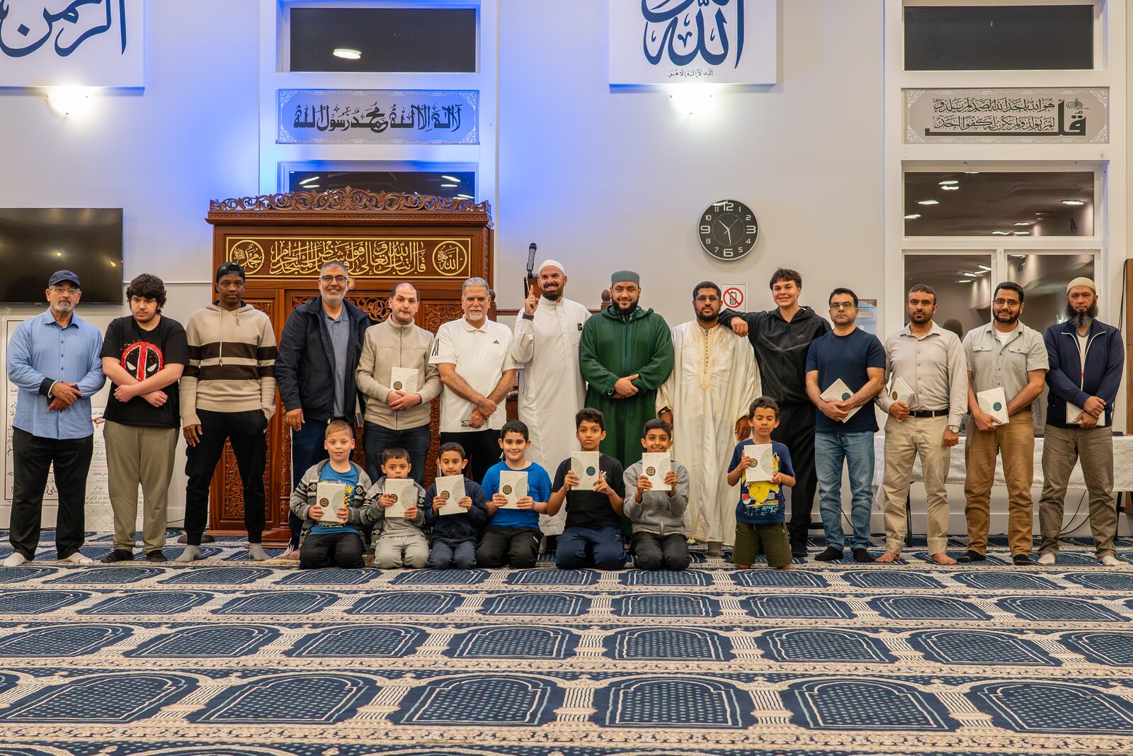 Worshippers gathered in prayer in a masjid.