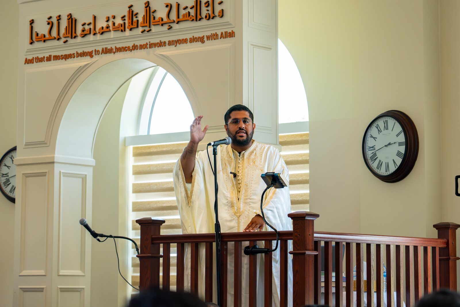 A Salik speaker sharing the message of the Qur'an with a congregation.